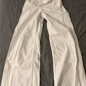 zara white flared asymmetrical button distressed jeans size 4